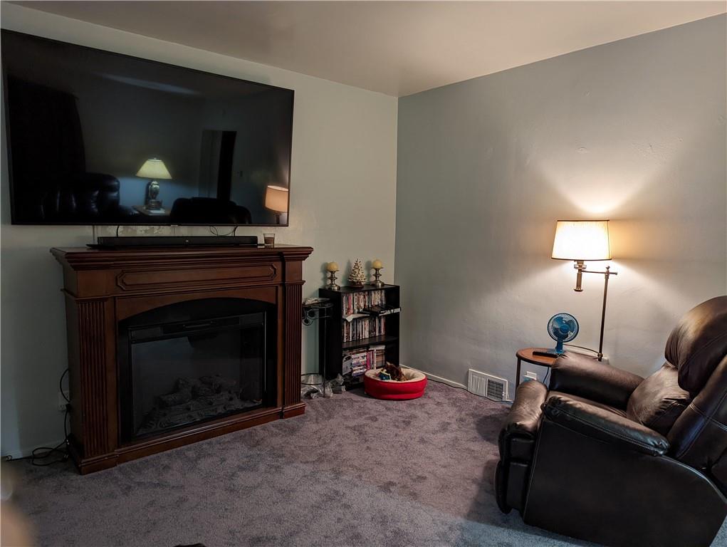 71 Blanche Road Fredericktown, PA 15333 - Photo 8 of 19 a living room with furniture and a fireplace