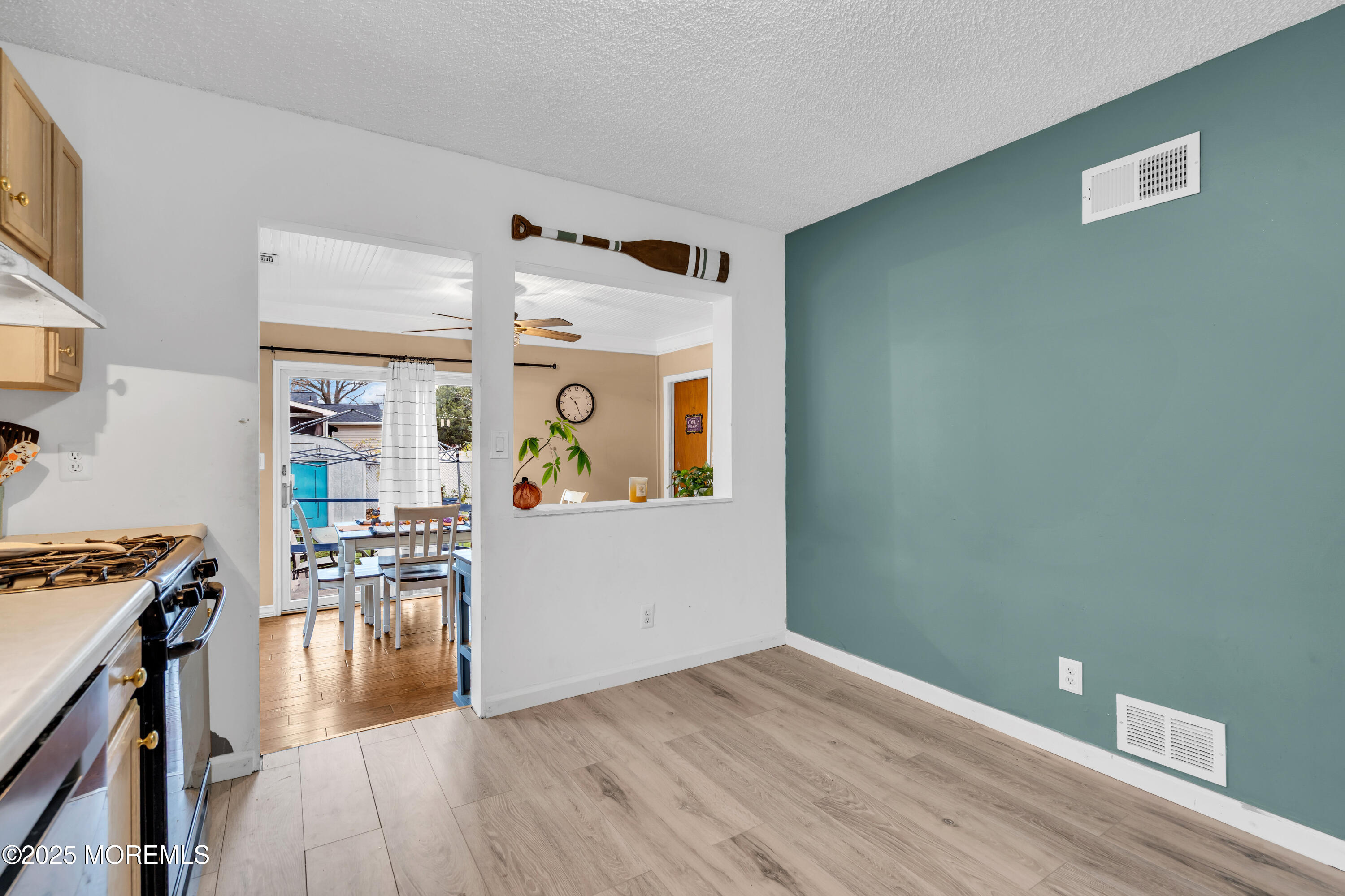 a view of a livingroom with furniture and wooden floor