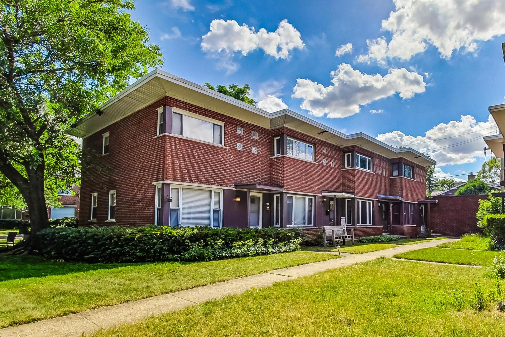 503 Ridge Road, Unit 503 Wilmette, IL 60091 - Photo 1 of 19 a front view of a house with a yard