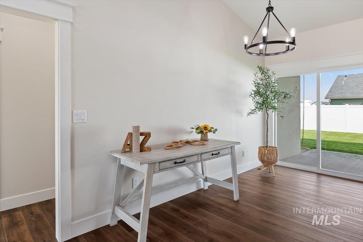 247 Sandi Road Twin Falls, ID 83301 - Photo 16 of 34 Doorway to outside with wood finished floors and a chandelier
