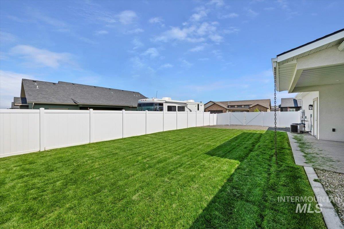 247 Sandi Road Twin Falls, ID 83301 - Photo 30 of 34 Fenced backyard with a patio area