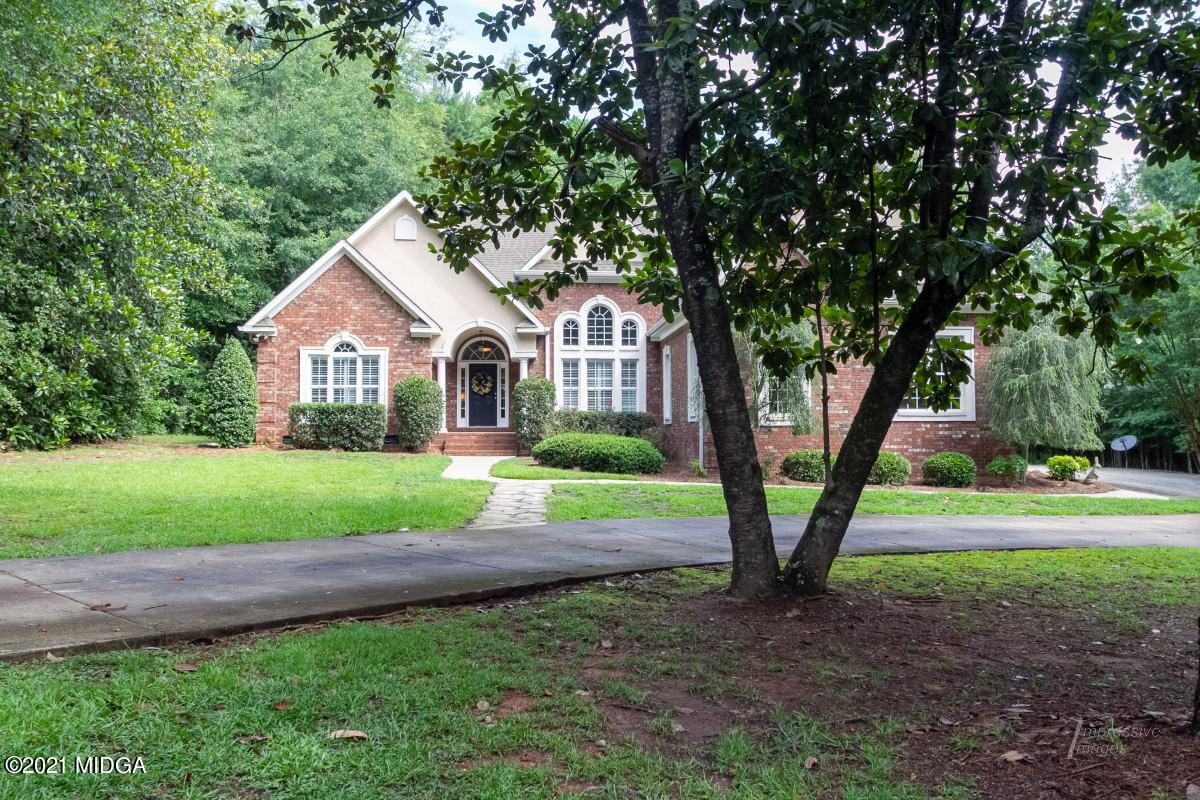7109 Colaparchee Road Macon, GA 31220 - Photo 2 of 34 a front view of a house with garden