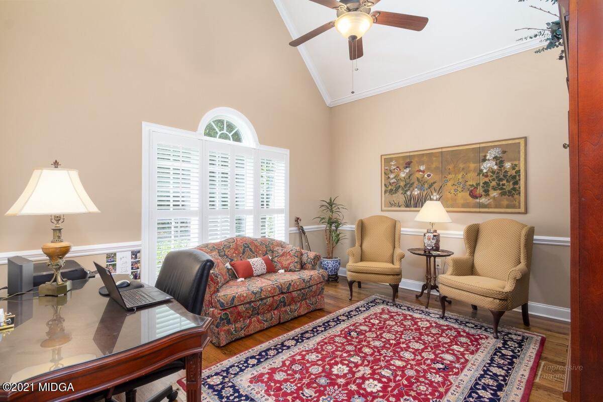7109 Colaparchee Road Macon, GA 31220 - Photo 11 of 34 a living room with furniture a rug and a large window