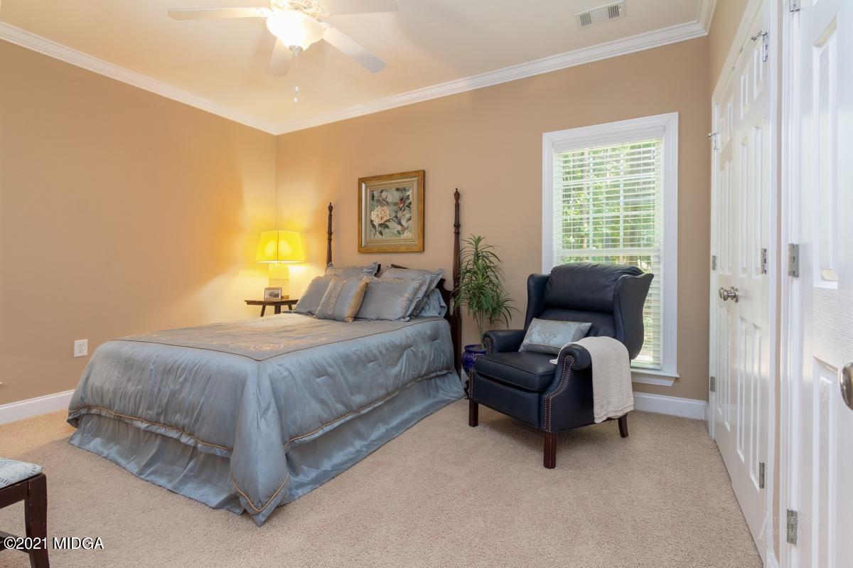7109 Colaparchee Road Macon, GA 31220 - Photo 24 of 34 a bedroom with a bed and a couch