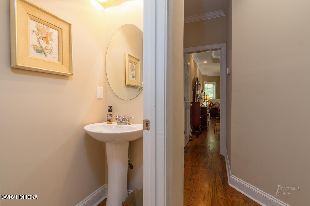 7109 Colaparchee Road Macon, GA 31220 - Photo 25 of 34 a bathroom with a sink and a mirror