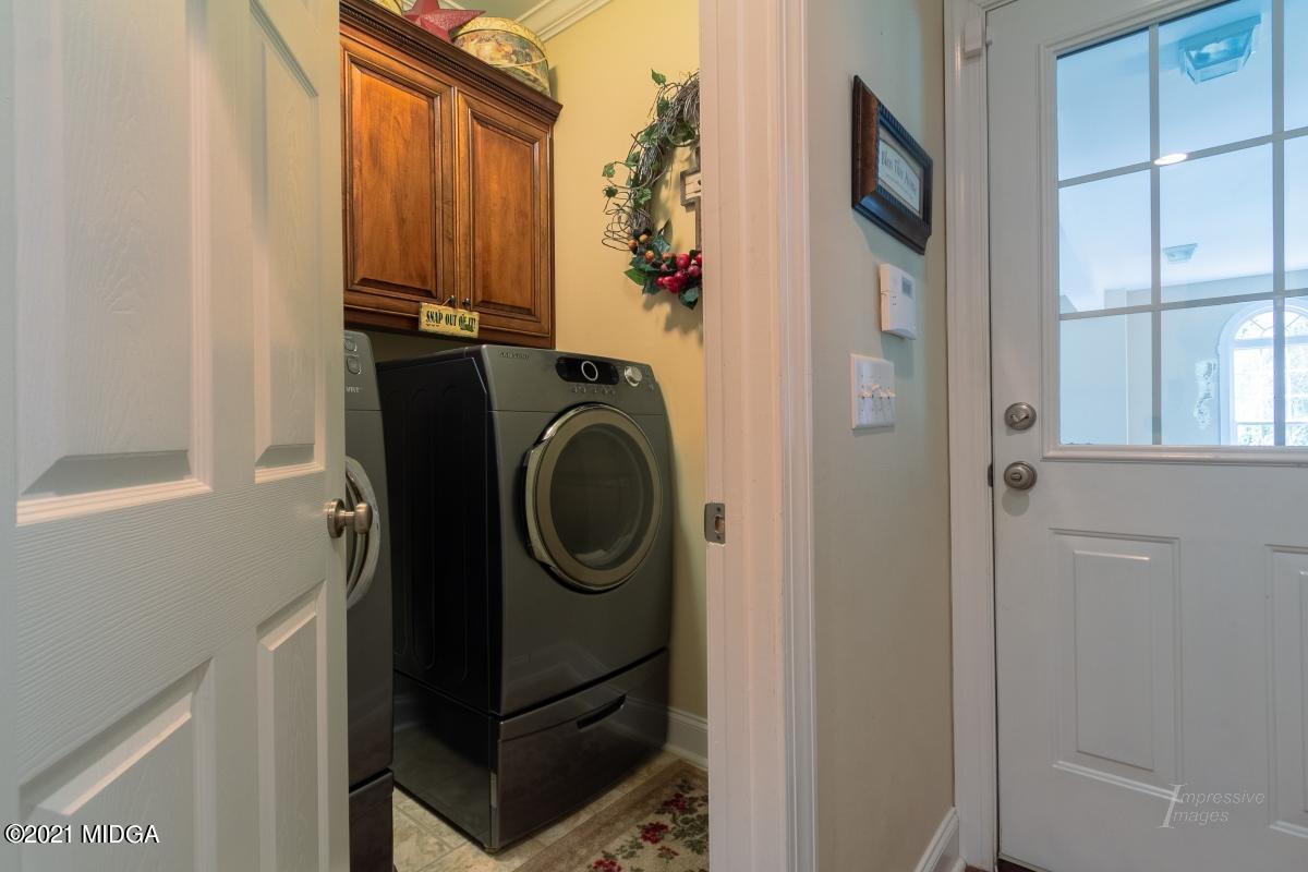 7109 Colaparchee Road Macon, GA 31220 - Photo 30 of 34 a utility room with dryer and washer