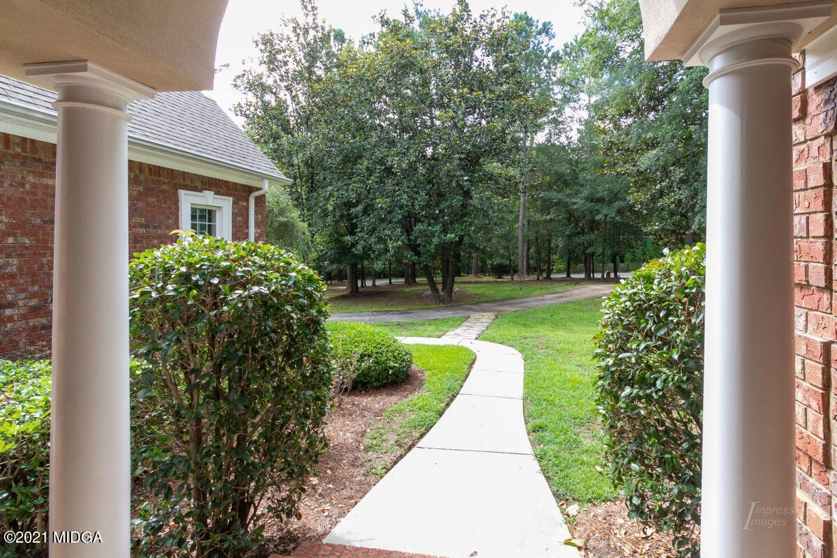 7109 Colaparchee Road Macon, GA 31220 - Photo 4 of 34 a front view of a house with a yard