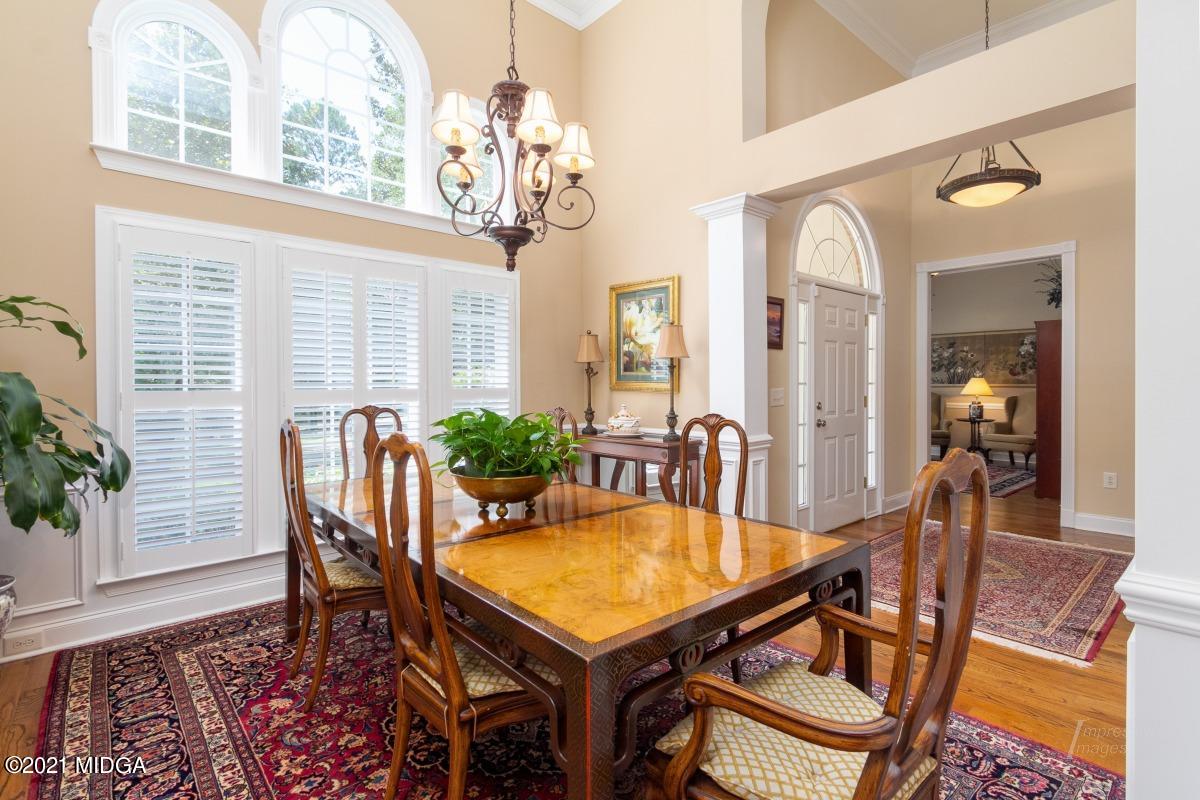 7109 Colaparchee Road Macon, GA 31220 - Photo 5 of 34 a view of a dining room with furniture and chandelier