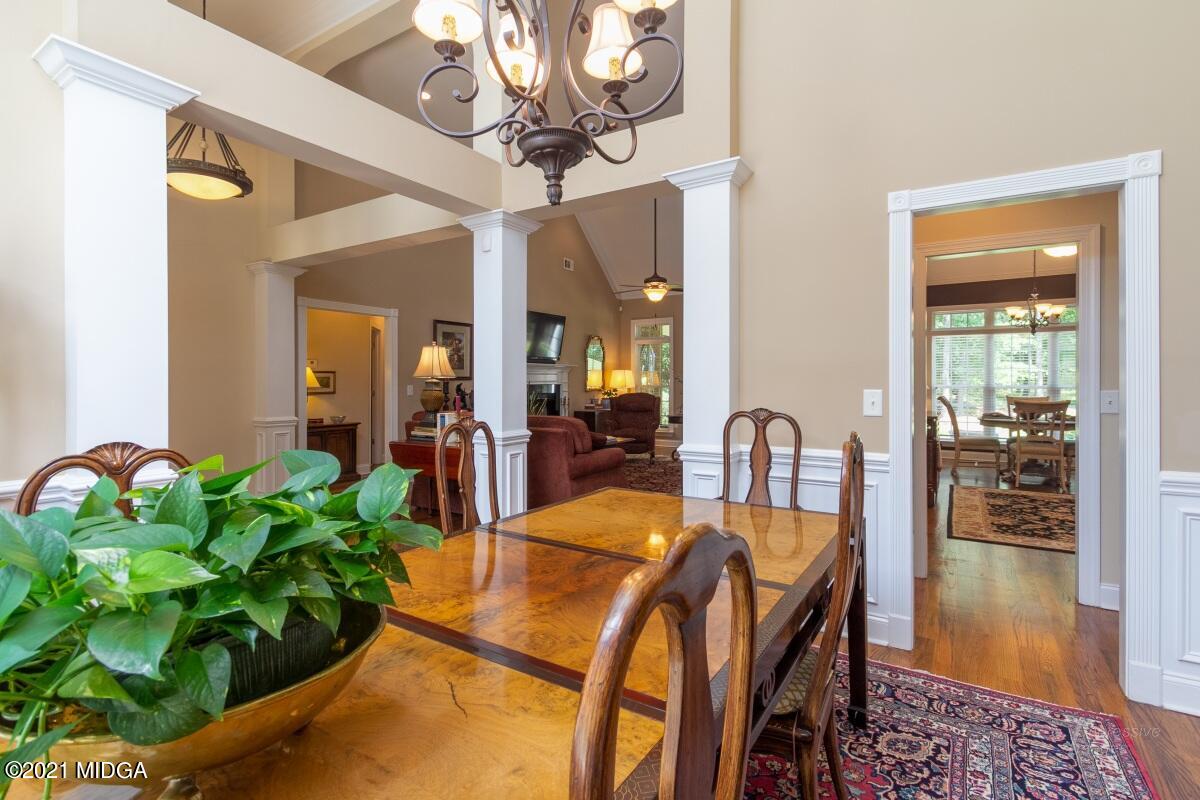 7109 Colaparchee Road Macon, GA 31220 - Photo 6 of 34 a dining room filled chandelier and wooden floor