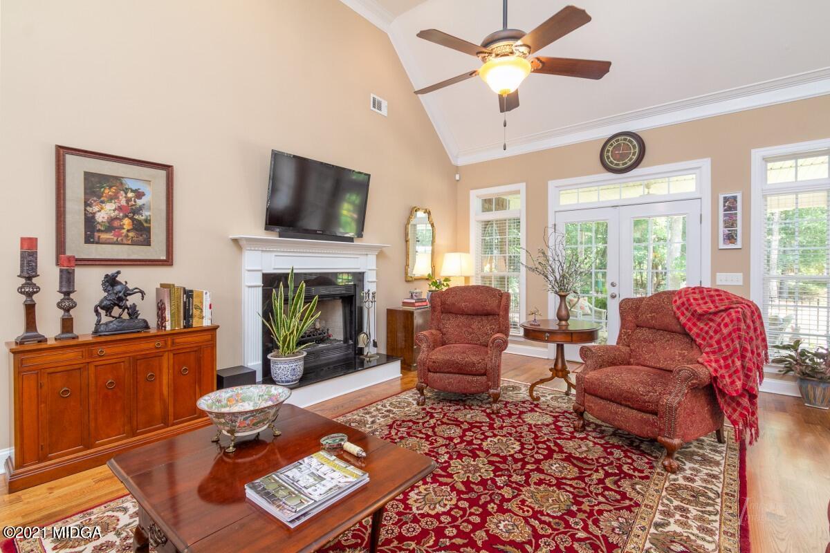 7109 Colaparchee Road Macon, GA 31220 - Photo 8 of 34 a living room with furniture and a fireplace