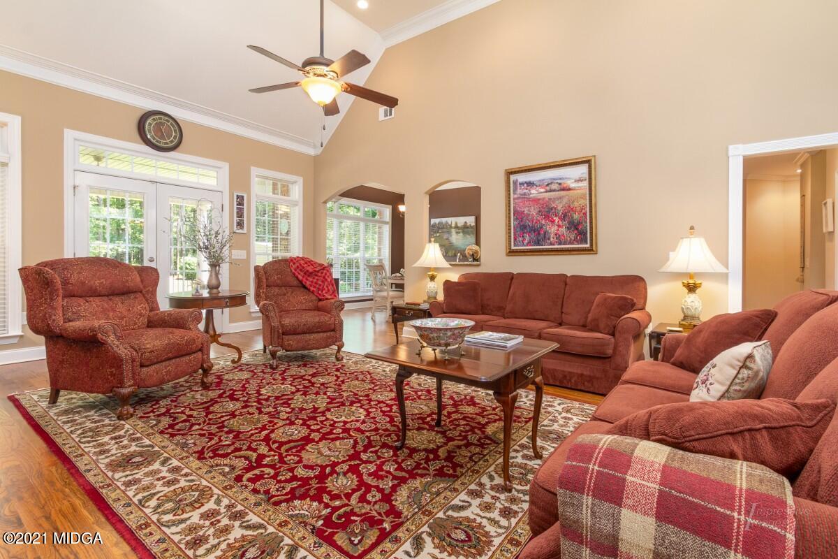 7109 Colaparchee Road Macon, GA 31220 - Photo 10 of 34 a living room with furniture and a large window