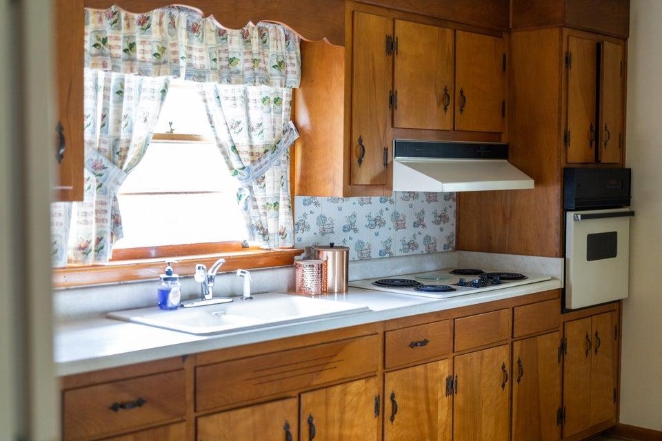 48 Round Hill School Road Fort Defiance, VA 24437 - Photo 13 of 37 a kitchen with stainless steel appliances granite countertop a sink a stove and a microwave