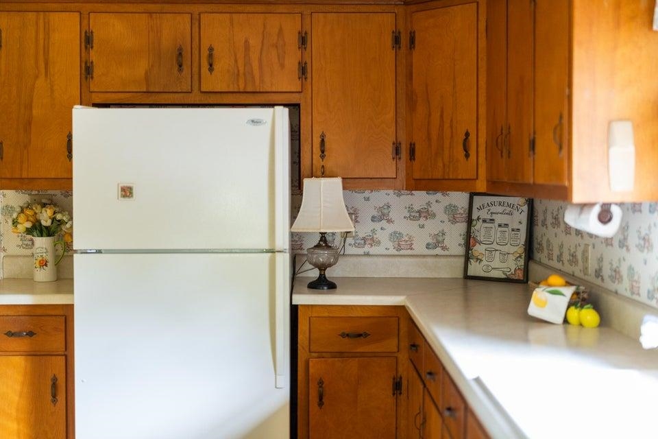 48 Round Hill School Road Fort Defiance, VA 24437 - Photo 16 of 37 a kitchen with a refrigerator a stove and a window