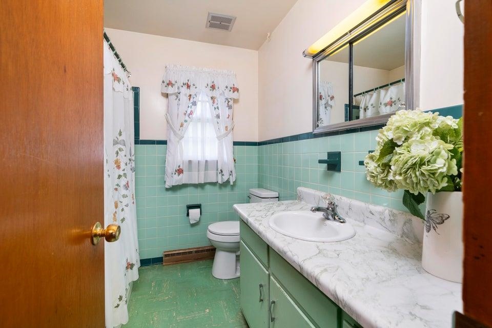 48 Round Hill School Road Fort Defiance, VA 24437 - Photo 17 of 37 a bathroom with a sink and a mirror