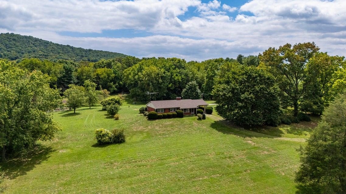 48 Round Hill School Road Fort Defiance, VA 24437 - Photo 34 of 37 a backyard of a house with table and chairs