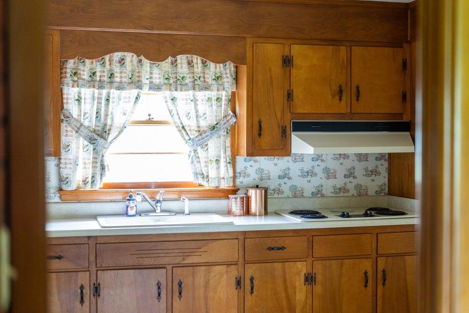 48 Round Hill School Road Fort Defiance, VA 24437 - Photo 10 of 37 a kitchen with a sink a window and cabinets