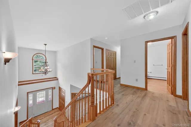 a view of an entryway with wooden floor