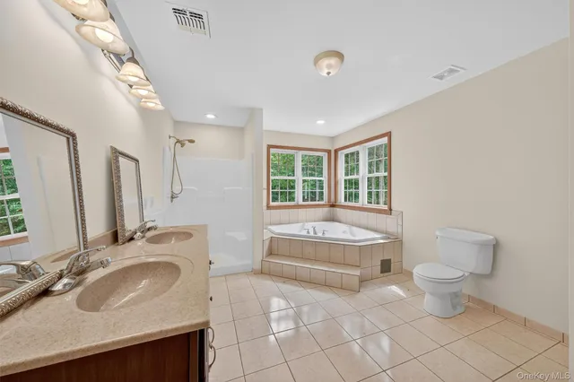 a bathroom with a sink toilet and tub