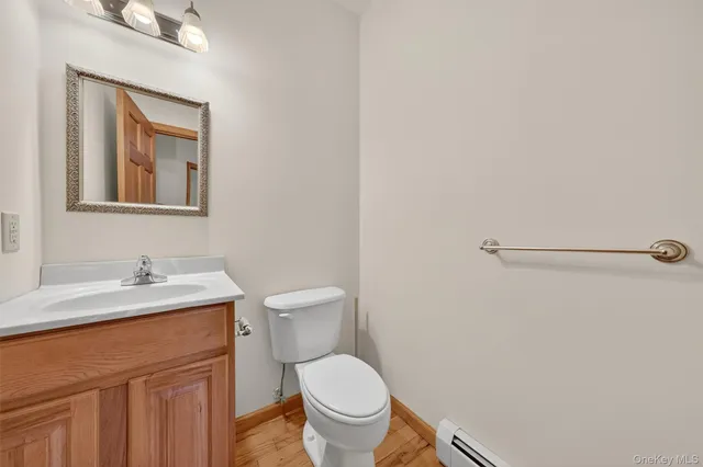 a white toilet sitting next to a bathroom sink