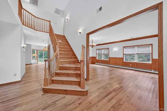 a view of entryway with wooden floor