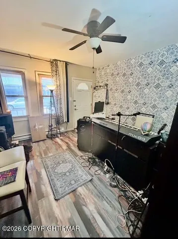 a living room with a couch and a flat screen tv