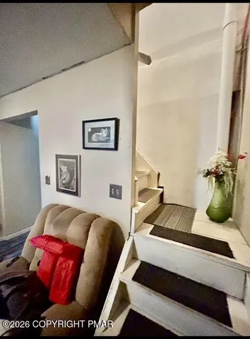 a bedroom with furniture and a couch