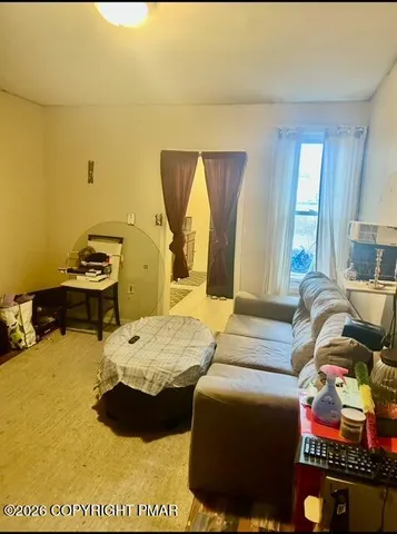 a bedroom with two beds and a couch