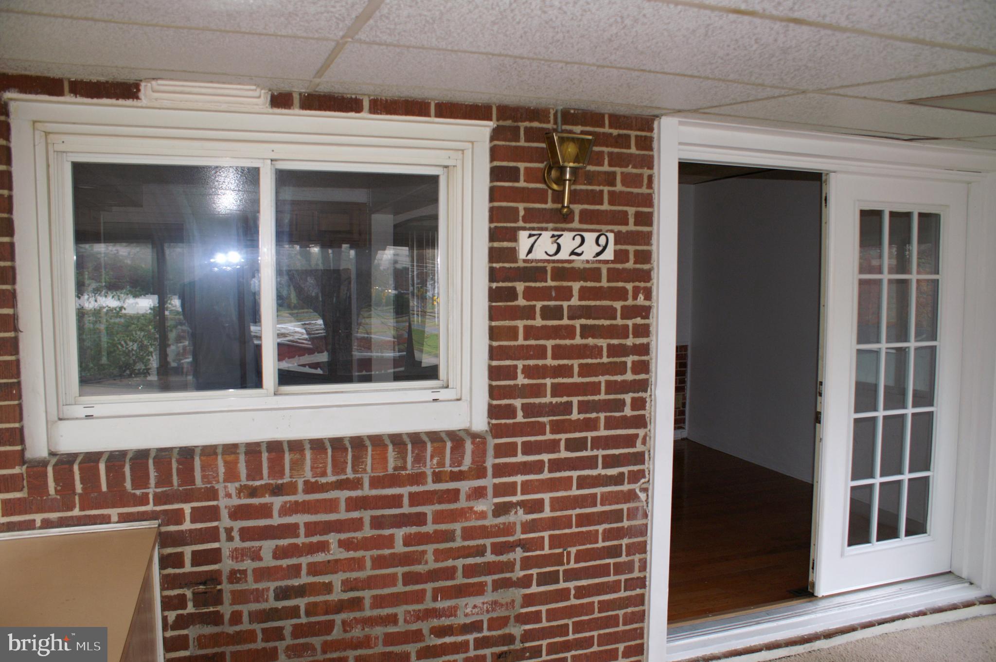 7329 Stratton Way Baltimore, MD 21224 - Photo 9 of 22 Exterior entrance into dining room from porch
