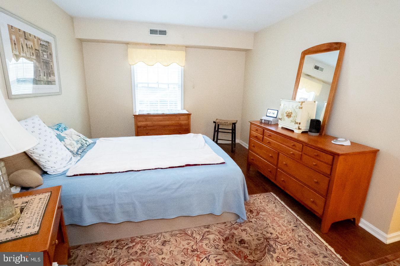 620 Manatawny Street, Unit CONDO 25 Pottstown, PA 19464 - Photo 20 of 28 a bed room with a bed and a dresser