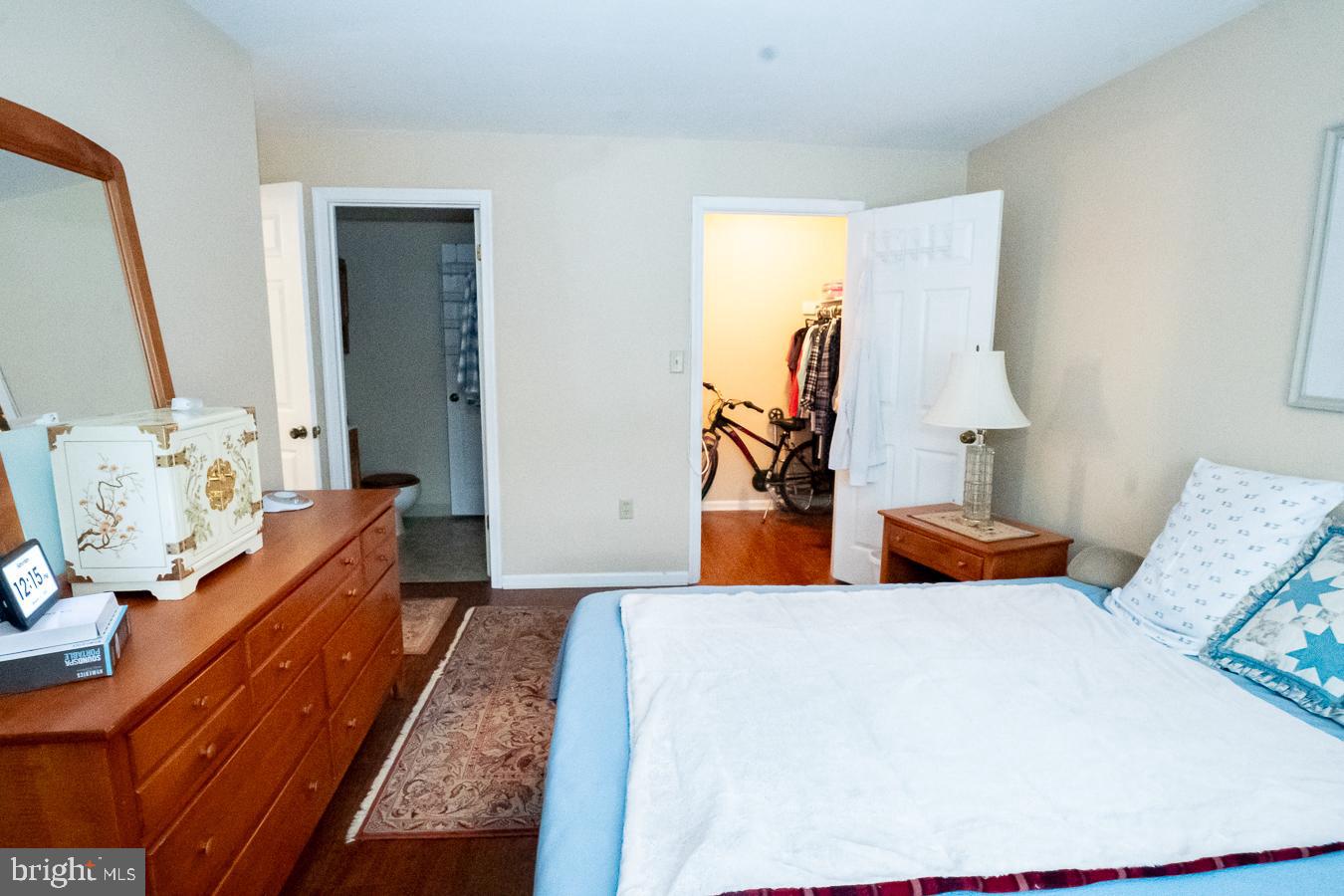 620 Manatawny Street, Unit CONDO 25 Pottstown, PA 19464 - Photo 22 of 28 a bedroom with furniture and wooden floor