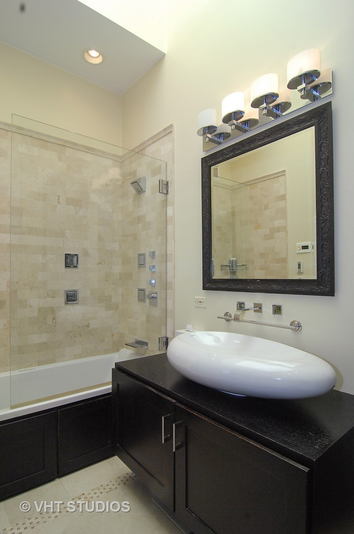 2017 North Sedgwick Street Chicago, IL 60614 - Photo 12 of 30 a bathroom with a sink vanity and a mirror