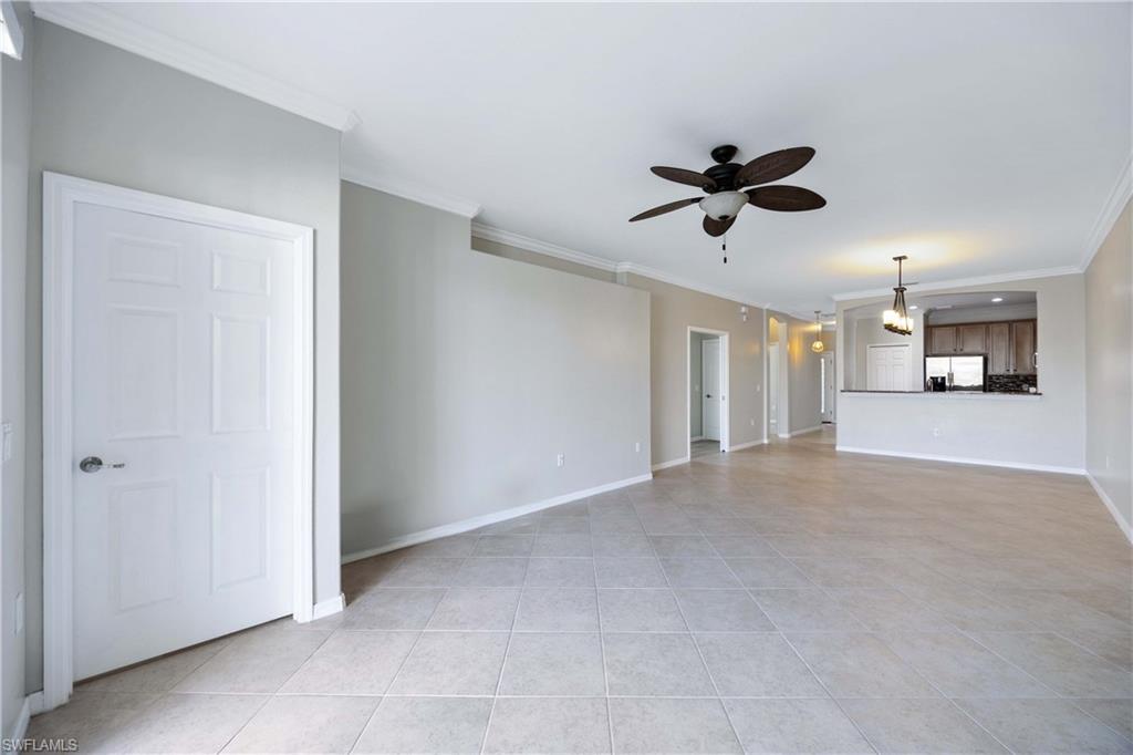 14488 Grapevine Drive Naples, FL 34114 - Photo 12 of 36 a view of a livingroom with a ceiling fan and entryway