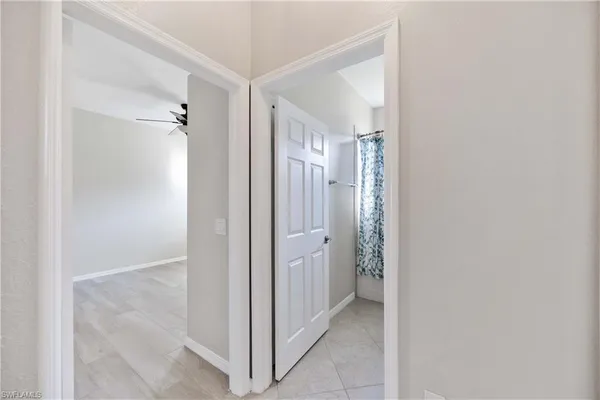 a bathroom with a sink toilet a mirror and shower