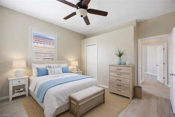 a bedroom with a bed and a dresser