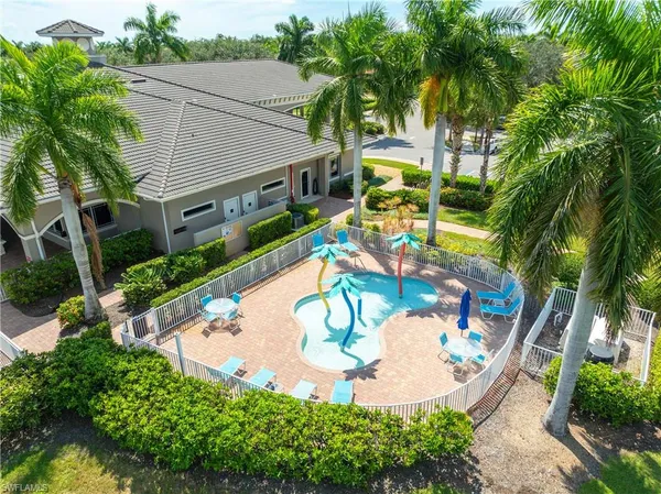 a view of backyard with a patio and plants