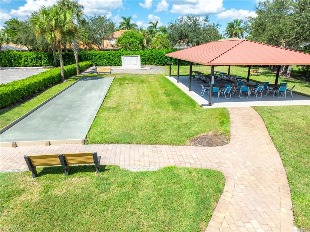 14488 Grapevine Drive Naples, FL 34114 - Photo 30 of 36 a view of backyard with a patio and plants