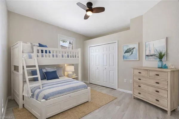 a bedroom with a large bed and a dresser