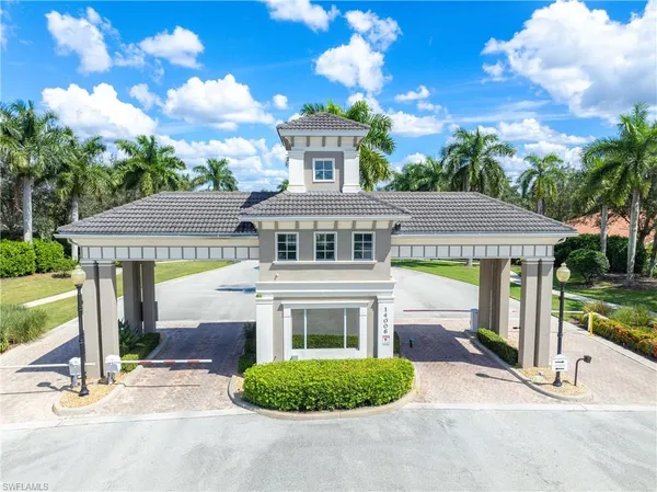 a view of a water fountain in front of a house