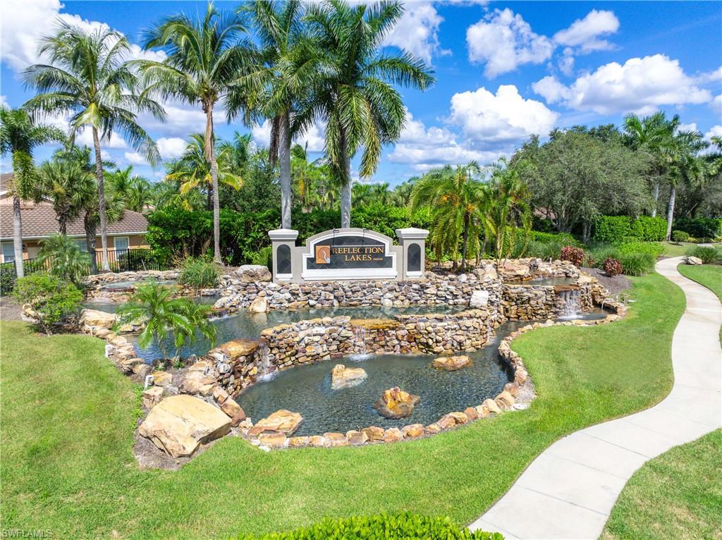 14488 Grapevine Drive Naples, FL 34114 - Photo 36 of 36 a view of a swimming pool with a patio