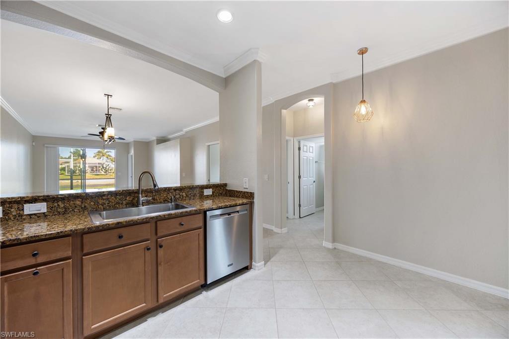 14488 Grapevine Drive Naples, FL 34114 - Photo 8 of 36 a large bathroom with a sink and a large mirror