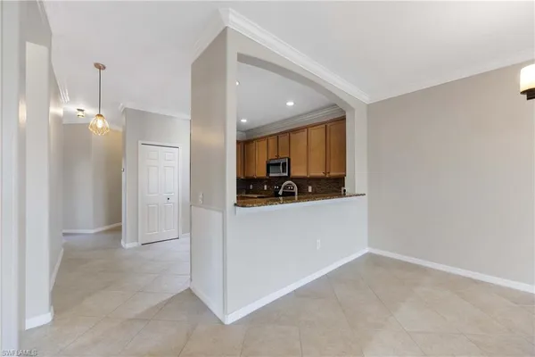 a view of kitchen and kitchen with a sink