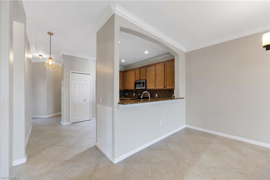 14488 Grapevine Drive Naples, FL 34114 - Photo 9 of 36 a view of kitchen and kitchen with a sink