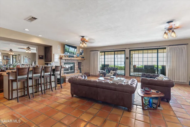 a living room with lots of furniture and white walls