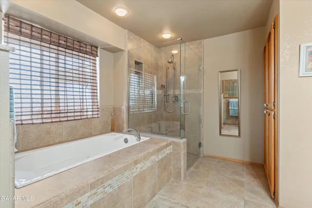 a bedroom with a bed and a fireplace