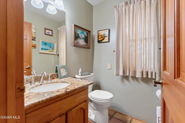 a view of a house with backyard porch and sitting area