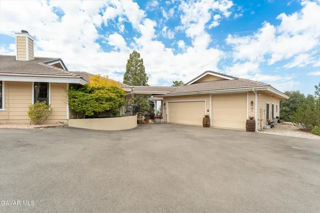 a view of a house with a outdoor space and porch