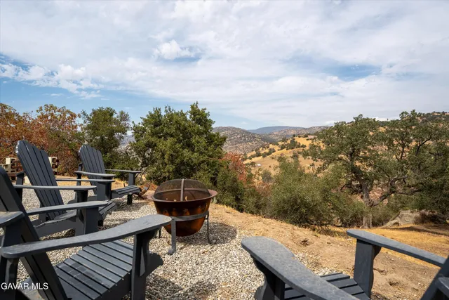 an aerial view of residential house and sandy dunes