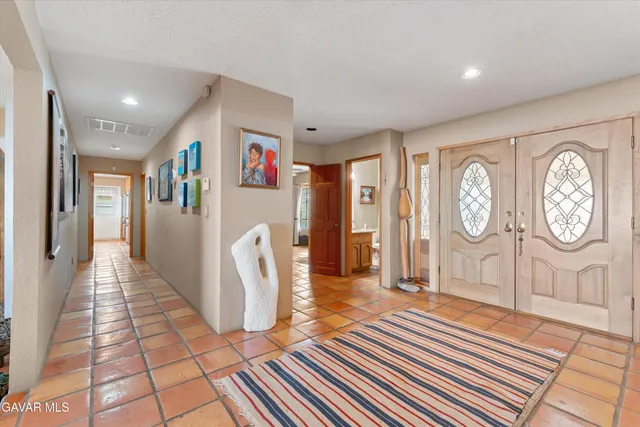 a living room with fireplace furniture and a flat screen tv