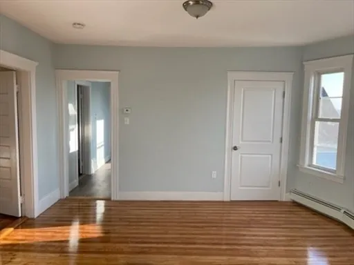 a view of a livingroom with wooden floor