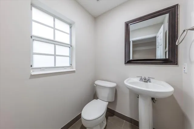 a kitchen with stainless steel appliances granite countertop a sink and a stove